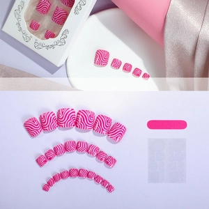 Handmade press-on toenails set in pink and purple wavy patterns with file and adhesive