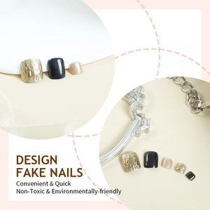 Luxury black and gold press-on toenails featuring 3D embossed patterns and golden glitter