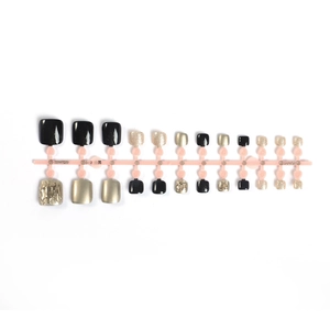 Luxury black and gold press-on toe nails set featuring mirror finish and gold glitter
