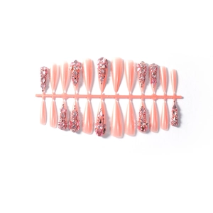 Pink stiletto press-on nails with luxury rhinestones and sparkling glitter accents