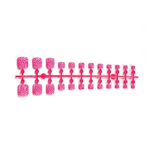 Pink and dark red wavy marble pattern press-on toe nails set on professional sprue frame