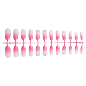 Pink and white gradient oval press-on nails with silver rhinestones on mold holder