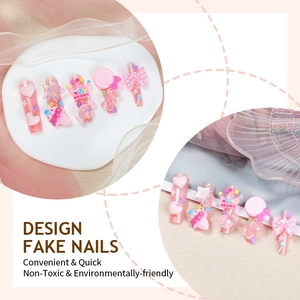 Extra long pink press-on nails with 3D resin heart, bear, and candy decorations