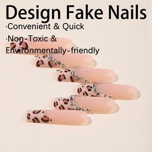 Pink press-on fake nails with leopard print tips and elegant rhinestone accents