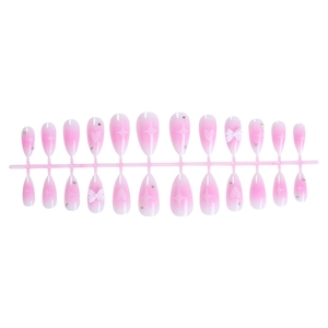 Almond ombre press-on nails with pink gradient, white bows, and heart star accents