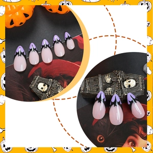 Halloween stiletto false nails featuring purple bat wing designs and nude pink base