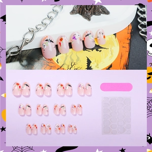 Halloween press-on nails set with 24 pieces featuring ghost, pumpkin and bat patterns
