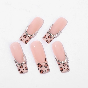 Coffin press-on nails featuring French leopard print tips and sparkling silver rhinestones