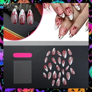 Long stiletto press-on nails with white French tips and red blood drop Halloween design