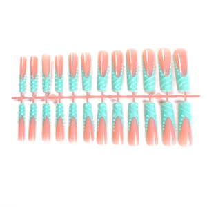 Extra long mint green press-on nails with 3D embossed wave patterns and silver glitter