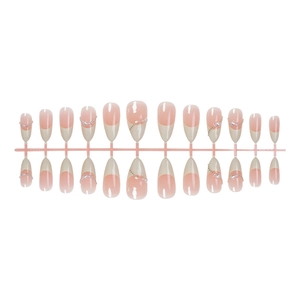 French almond press-on nails in nude pink with cream white tips and pearl accents