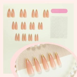 Long almond press-on nails with nude pink base and gold glitter French tips set