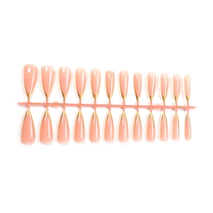 Long tapered press-on nails set with nude pink base and gold French V-shaped tips