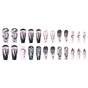 Gothic stiletto press-on nails set with moon and star patterns in pink and black