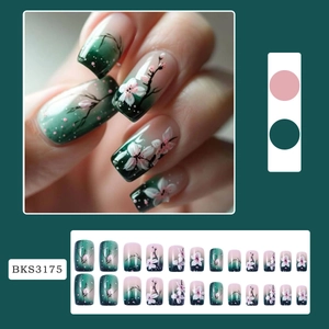Dark green gradient press-on nails with pink cherry blossom floral designs and 24 pieces