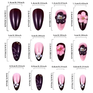 Brown French press-on nails almond shape size guide with 3D floral and golden accents