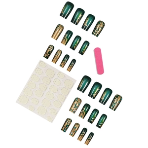 Deep green and gold press-on nail kit with luxury marble patterns and rhinestones