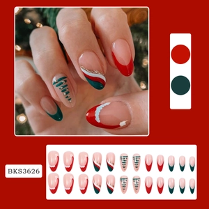 Christmas press-on nails with red and green wave patterns, trees and gold glitter motifs