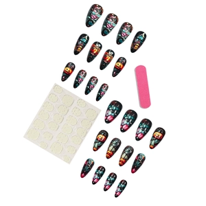 Halloween press-on nail kit featuring black pumpkin and haunted house designs with tools