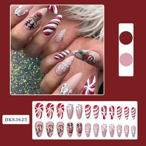 Christmas press-on nails featuring gingerbread man and reindeer almond nail art kit