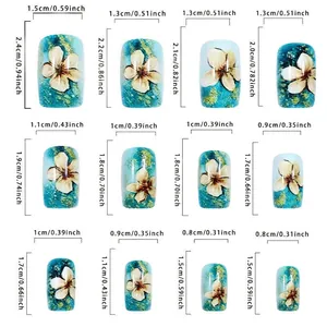 Size chart for floral press-on nails with dimensions in centimeters and inches for precision