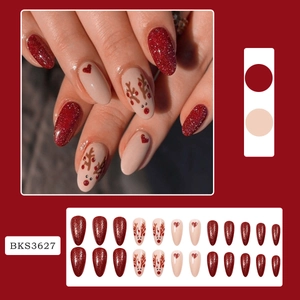 Christmas red glitter almond press-on nails with reindeer and heart design motifs