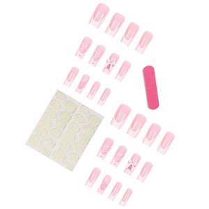 French tip press-on nails with white bows and pearls on a sweet pink base set