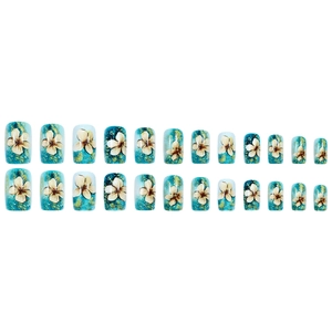 Blue gradient press-on nails with white flowers and gold foil accents in medium length