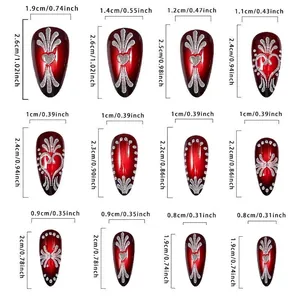 Deep red almond press-on nails with silver heart patterns and size chart specifications