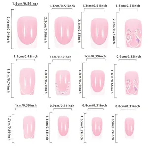 Tableau des tailles d'ongles à coller style français avec nœuds et perles blancs