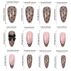 Size chart for French polka dot press-on nails with pearl bows in various dimensions