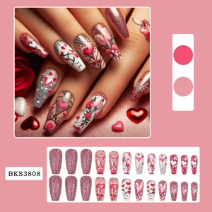 Pink glitter press-on nails with heart and rose patterns for Valentine's Day style