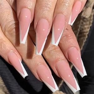 Detailed view of long coffin press-on nails featuring nude pink base and white V-tip French design