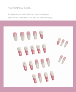 Macro detail of long coffin press-on nails with pink gradient and gold foil accents