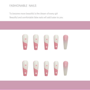 Detail of pink and white ballet false nails with wave patterns and gradient finish