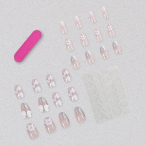 Pink and purple gradient press-on nails with bow accents and French heart designs