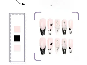 Detail of long ballerina press-on nails with black glitter tips and 3D crown rhinestones