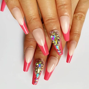 Detailed view of long coffin press-on nails with rose red French tips and iridescent rhinestones