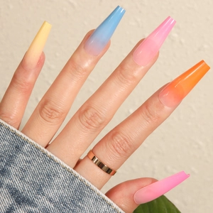 Long coffin gradient press-on nails featuring vibrant yellow, pink, and blue hues