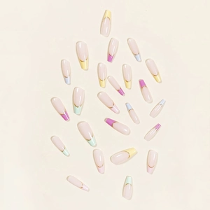 Macro view of long ballerina press-on nails with colorful French tips and gold outlines