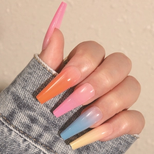 Glossy long coffin press-on nails with colorful pastel gradient on female model