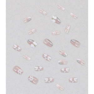 French bow press-on nails with silver glitter gradient and white 3D heart heart details