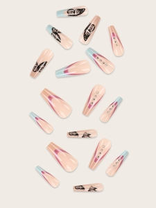 Detail of coffin shape press-on nails with butterfly prints and rhinestone accents