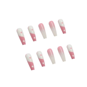 Detail of pink and white gradient coffin press-on nails with wave and dot art design