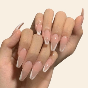 Long ballerina press-on nails with nude pink base and classic white V-shaped French tips