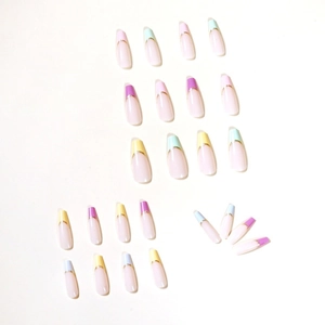 Long coffin press-on nails with macaron French tips and gold line accents