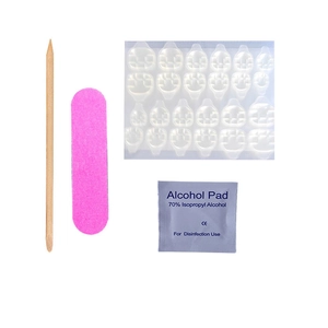 Complete 4-piece nail tool kit with jelly glue tabs, file, wood stick, and prep pad