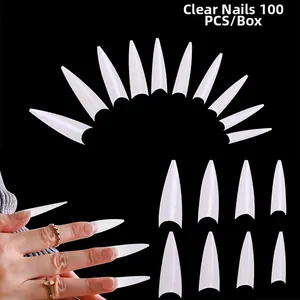 Macro detail of 100pcs transparent long stiletto toe nail tips in professional box