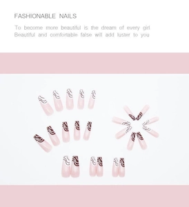 Close-up of pink coffin press-on nails featuring brown marble wave line patterns