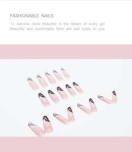 Detailed view of long ballet press on nails with pink base and black swirl line art